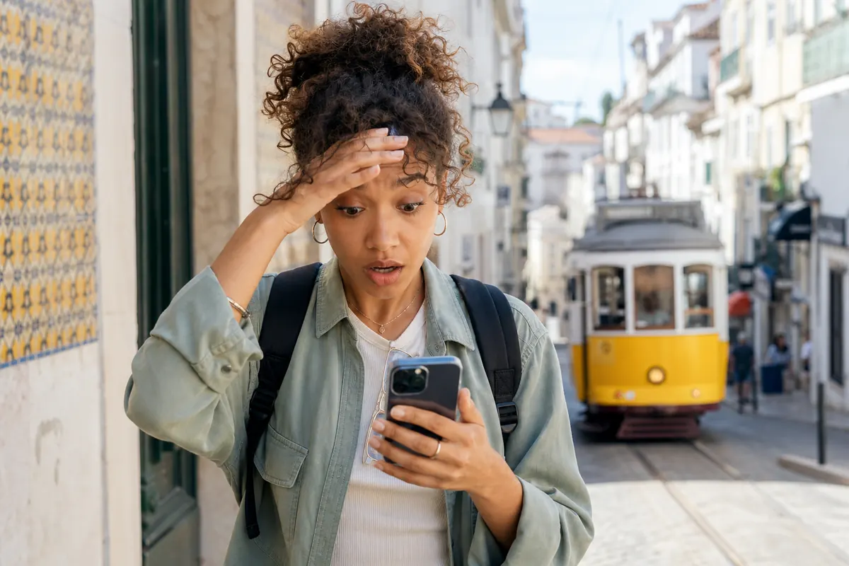 Student stressed by mobile roaming charges in Lisbon